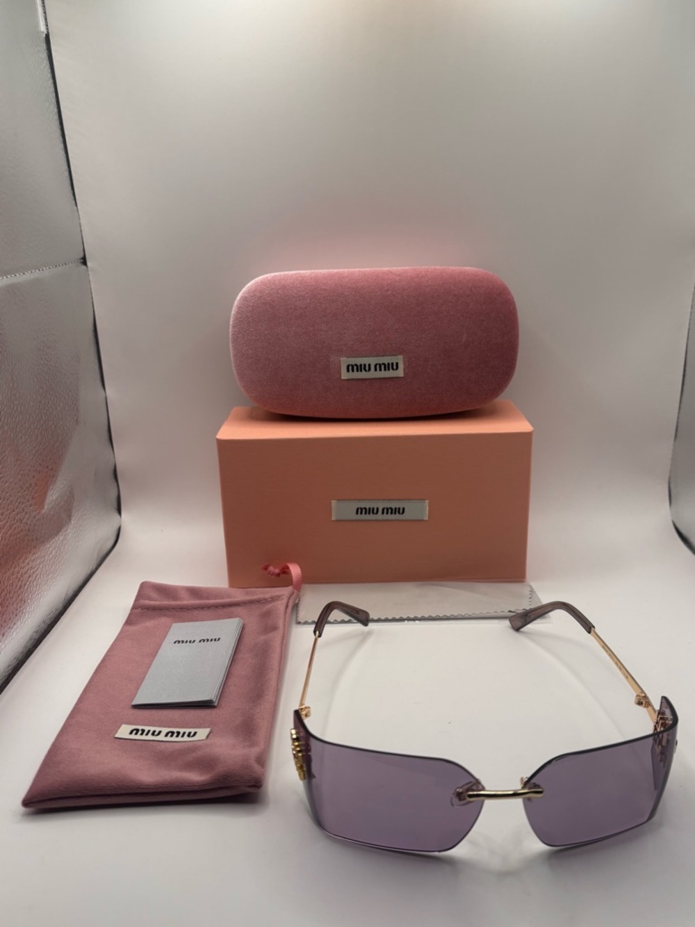 Miu Miu Pink Rimless Sunglasses with Gold Accents